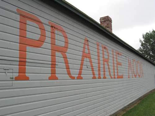 Gray building with large painted orange letters that read Prairie Moon