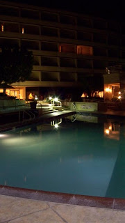 a pool at night with lights