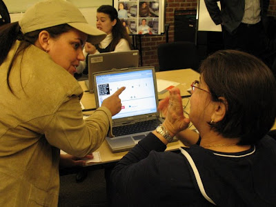 Karen Erickson and another woman looking at a computer screen