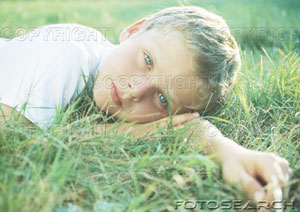 [boy-lying-in-grass-~-paa307000041.jpg]