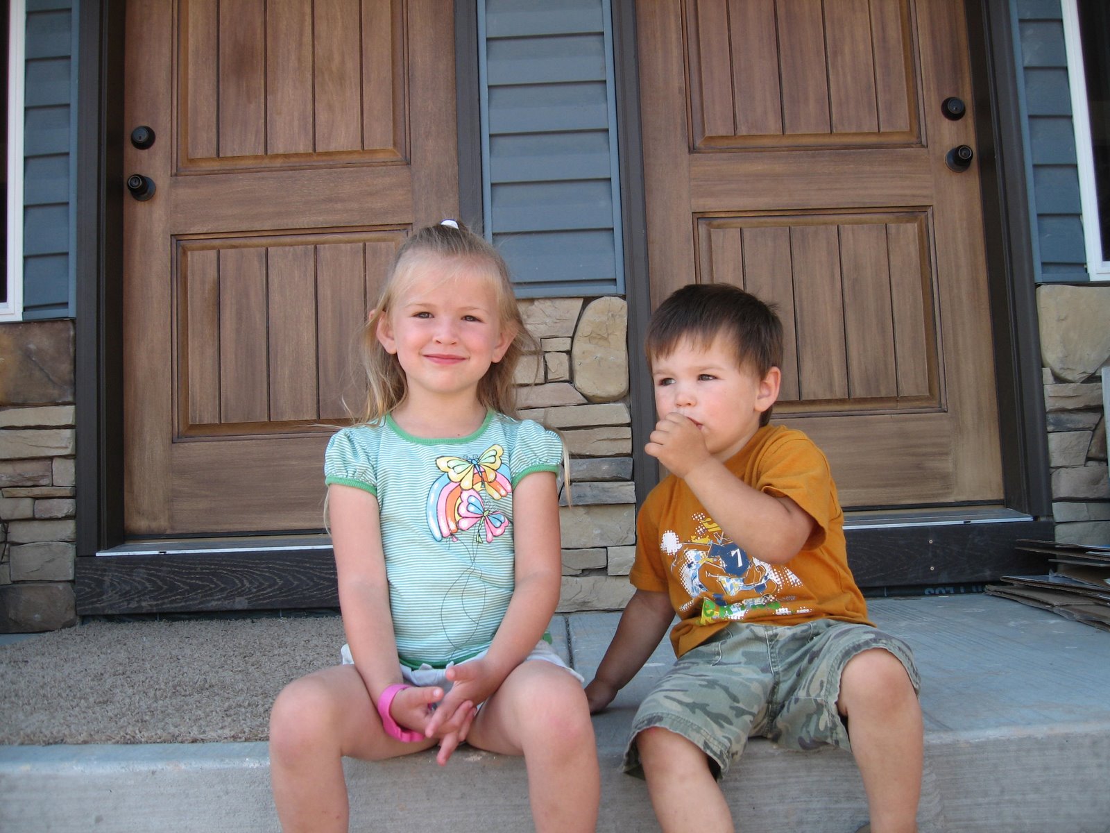 [Kamdin+&+Logan+in+front+of+their+new+house.JPG]