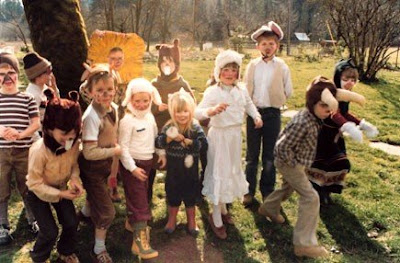 Autumn is in the sheep costume and white dress, to the right.