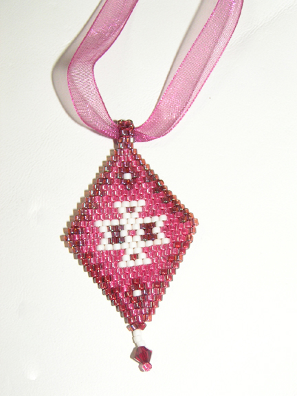 [#694,+necklace;+woven+on+pink+ribbon.jpg]