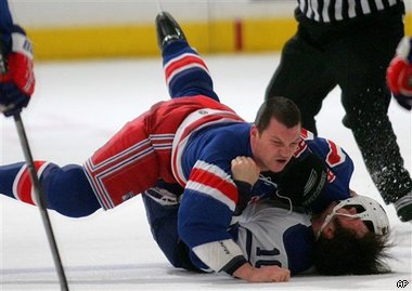 Sean Avery, top, slams Toronto Maple Leafs' Darcy Tucker to the ice during the first period