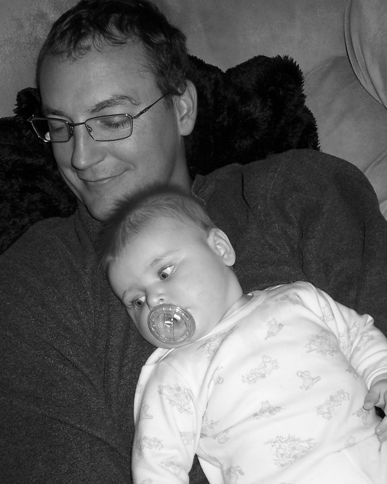 [laying+on+dad+black+and+white.JPG]