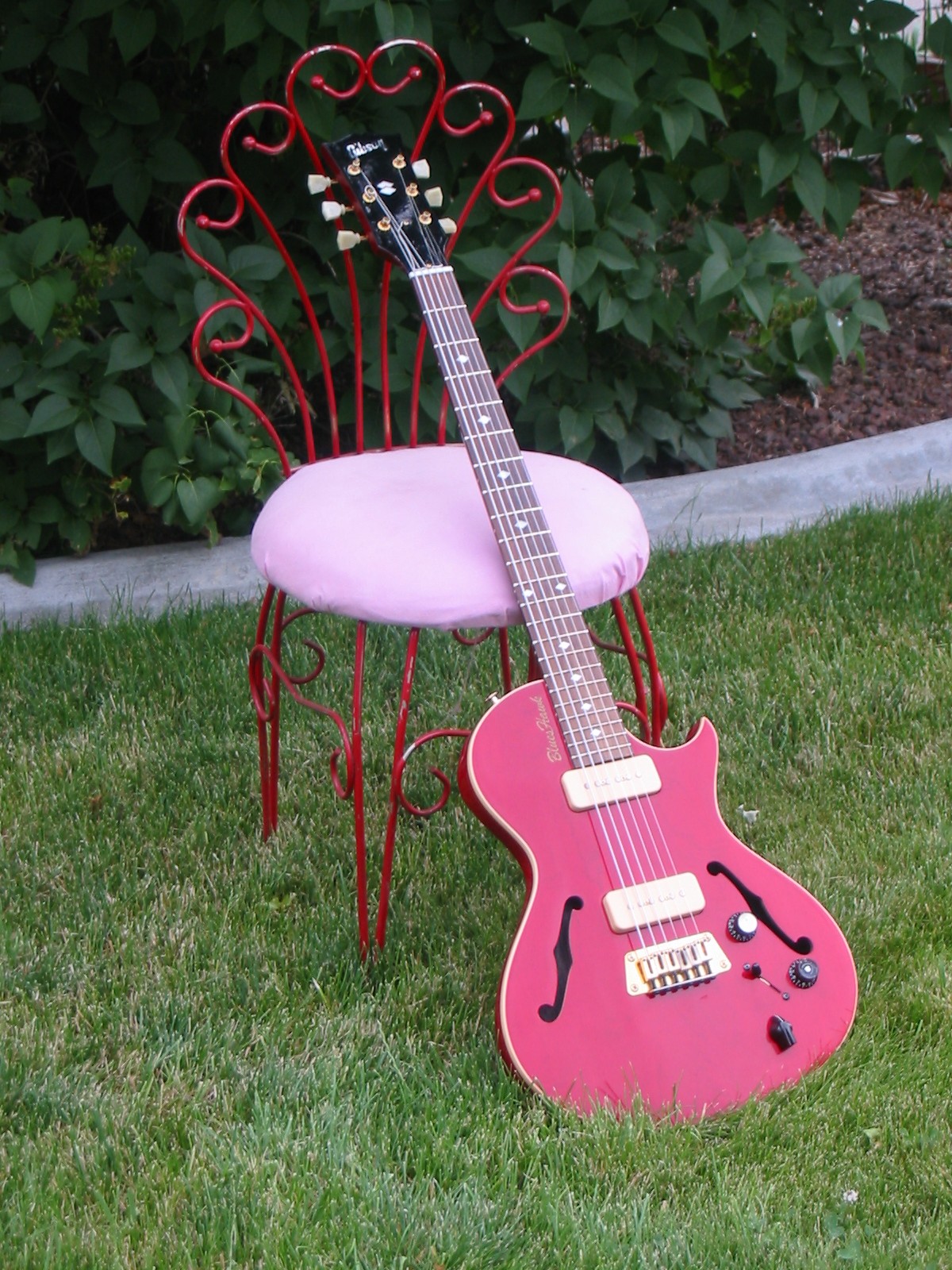 [red+guitar+and+pink+chair.jpg]