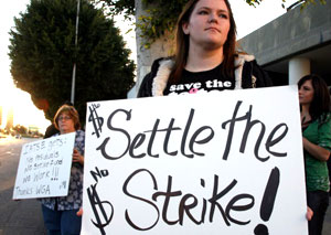 People demonstrate against the writers' strike outside the Beverly Hilton where the Golden Globes awards were announced at a press conference.