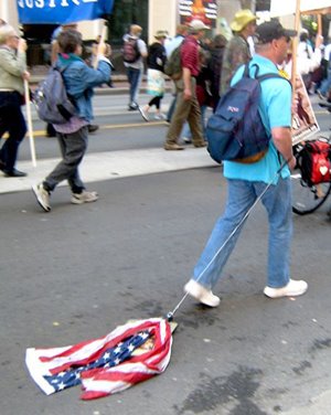 [Protester+Drags+Flag.jpg]
