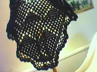 [Black+crochet+block+and+lace+shawl+draped+on+light.JPG]
