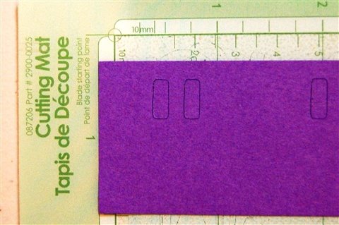 [placement+of+purple+paper+for+even+holes+for+threading.jpg]