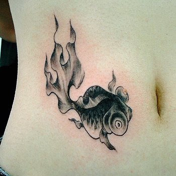 Gold fish tattoo design on the hip