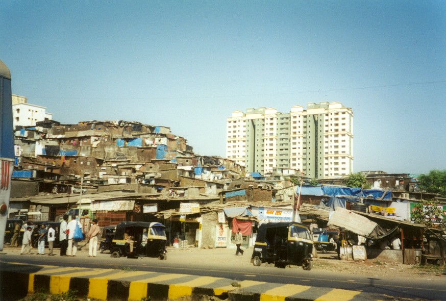 [India-Mumbai-aka-Bombay-slums-next-to-high-rise-flats-buggies-1-NC.jpg]