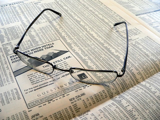 [glasses_on_newspaper.jpg]