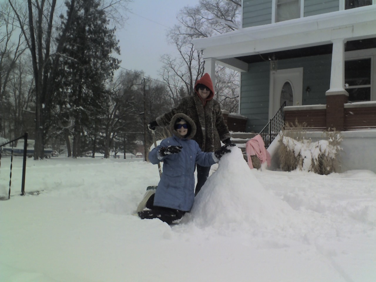 Bridget and Maryann working on their snowman.  They had fun outside getting wet and building this snowbaby with snow that just didn't want to pack. CLICK ME to see a bigger version.