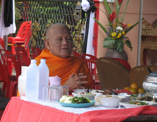 Monk praying at the funeral