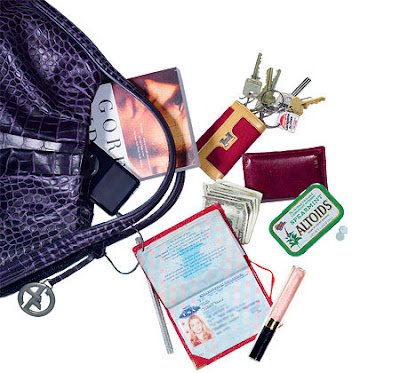 inside Ivanka Trump's purple Armani crocodile handbag are BlackBerry, Tic Tacs, keys, wallet, passport, hair ties